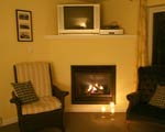 Living room features a romantic gas fireplace